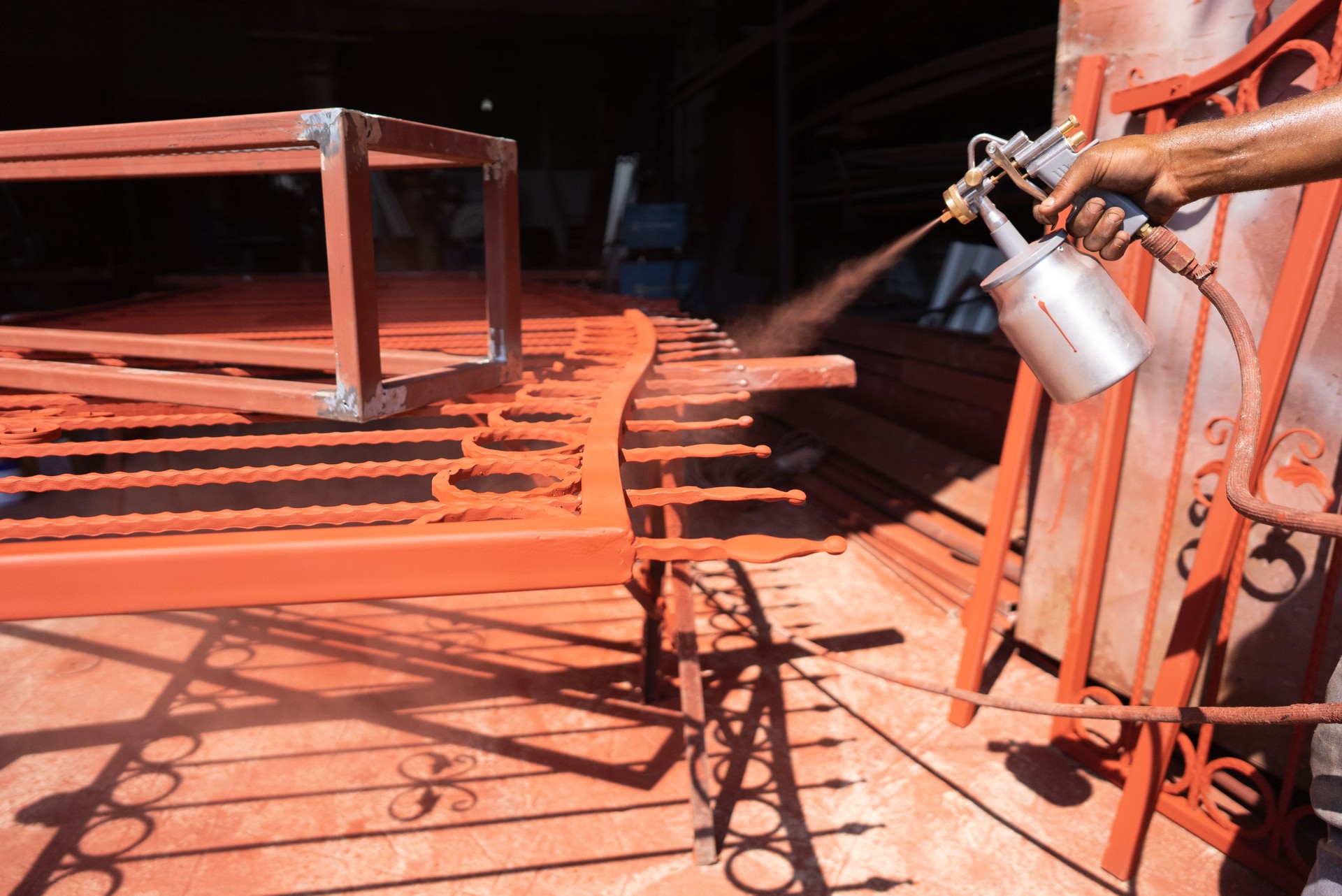 Metal painting worker in factory